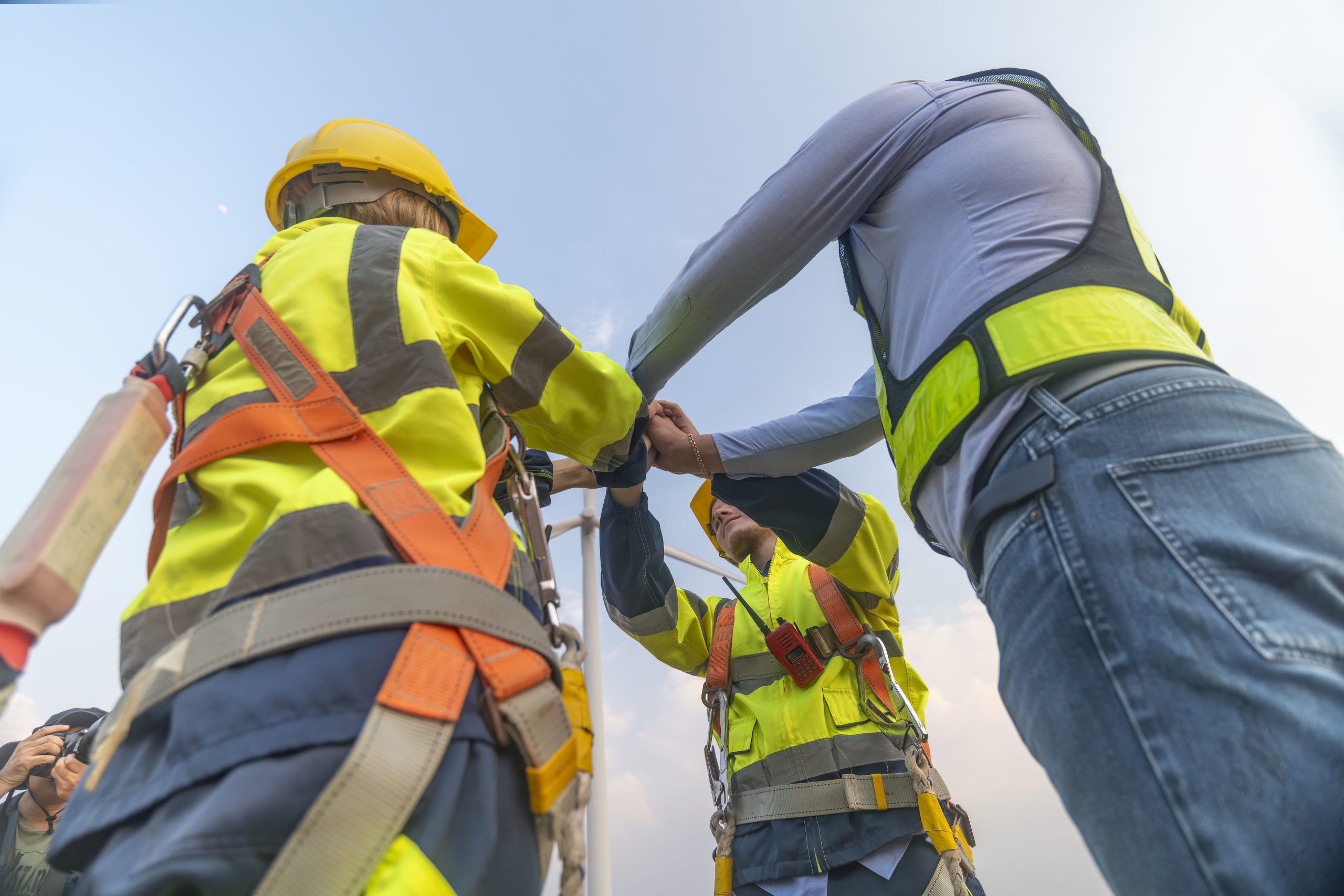 Engineer in a safety helmet reviewing OSHA compliance documents